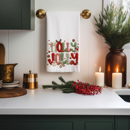 Kitchen counter with a decorative towel, candles, and festive decorations.